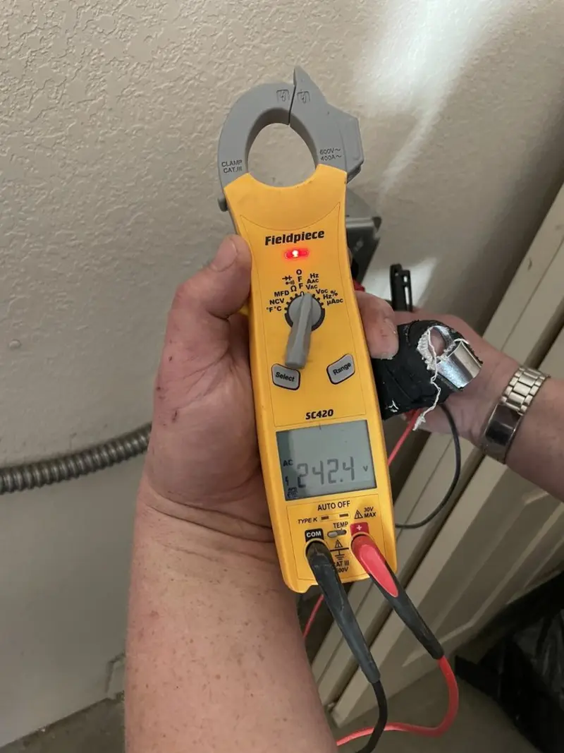 Voltage testing with clamp meter during Recessed Lighting Installation in Glenwood Springs